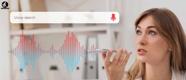 Businesswoman Using Smart Phone Voice Search App At Workplace